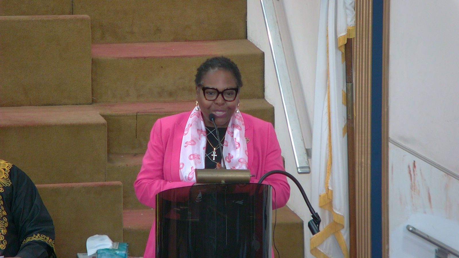 New York State Assembly Member Stefani Zinerman speaking at the pulpit, seen on the livestream
