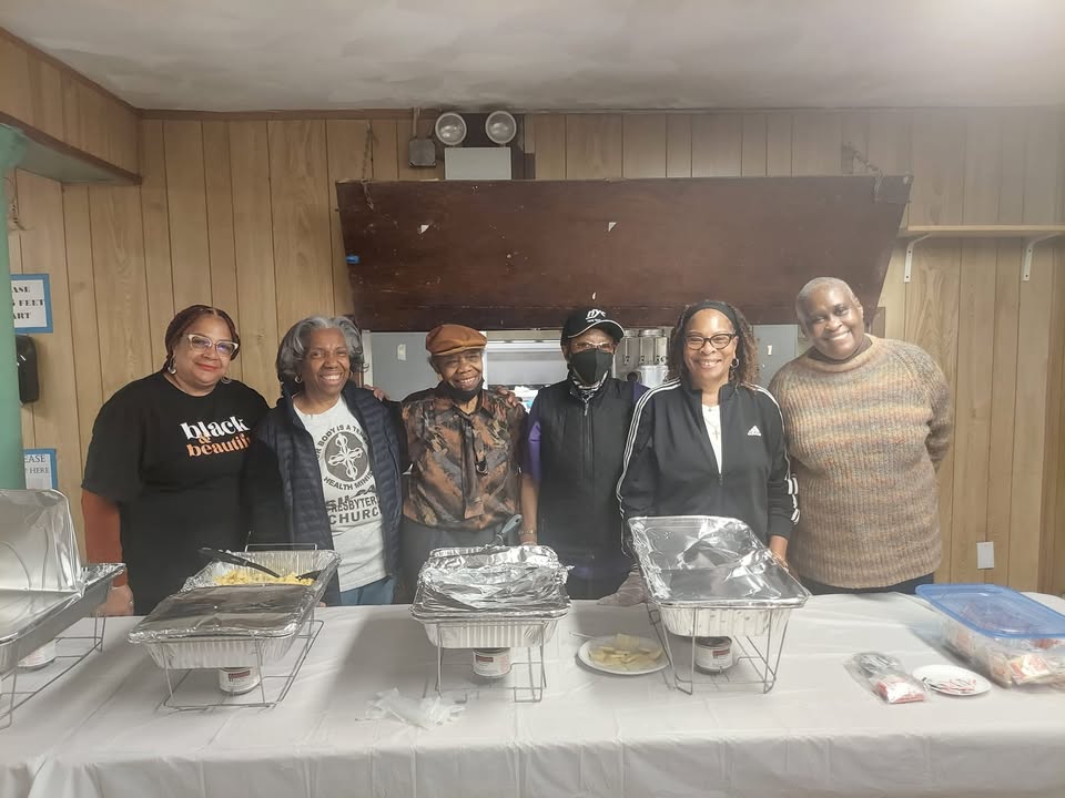 Siloam volunteers at a serving table in the church's fellowship hall